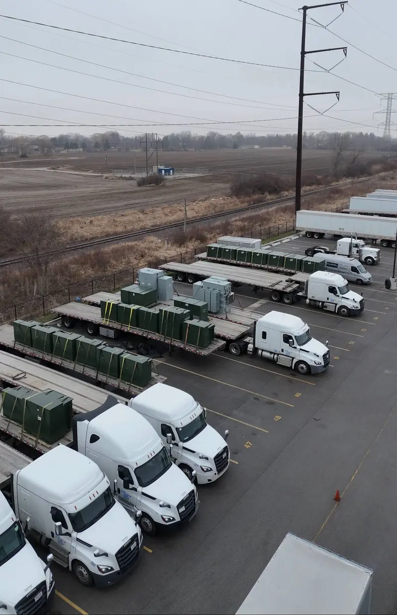 Numbered, striped parking stalls on the paved lot at Zion Truck Parking
